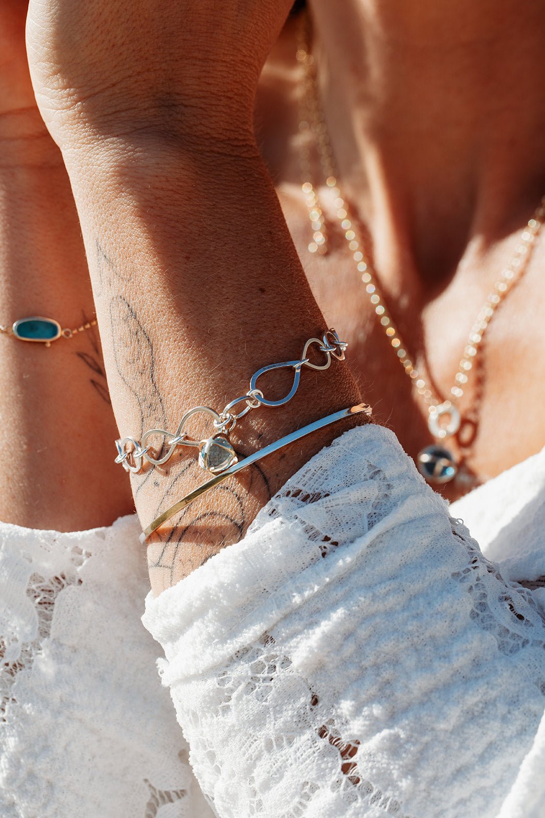 Ocean - Inspired Bracelet with Sky Blue Topaz Sphere in 9ct Gold Cage - Drop Of The OceanOcean - Inspired BraceletsBooblinka Jewellery