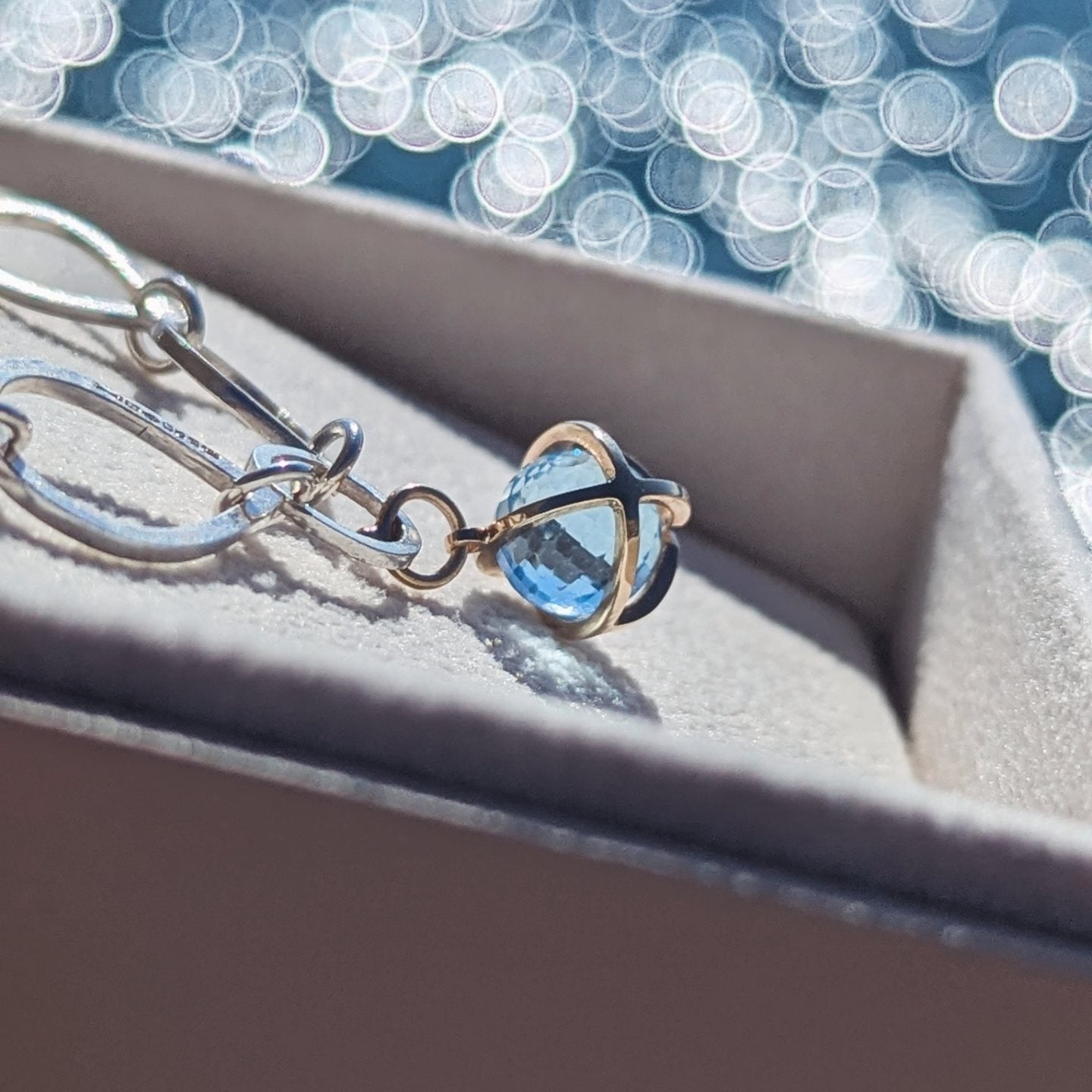 Ocean - Inspired Bracelet with Sky Blue Topaz Sphere in 9ct Gold Cage - Drop Of The OceanOcean - Inspired BraceletsBooblinka Jewellery
