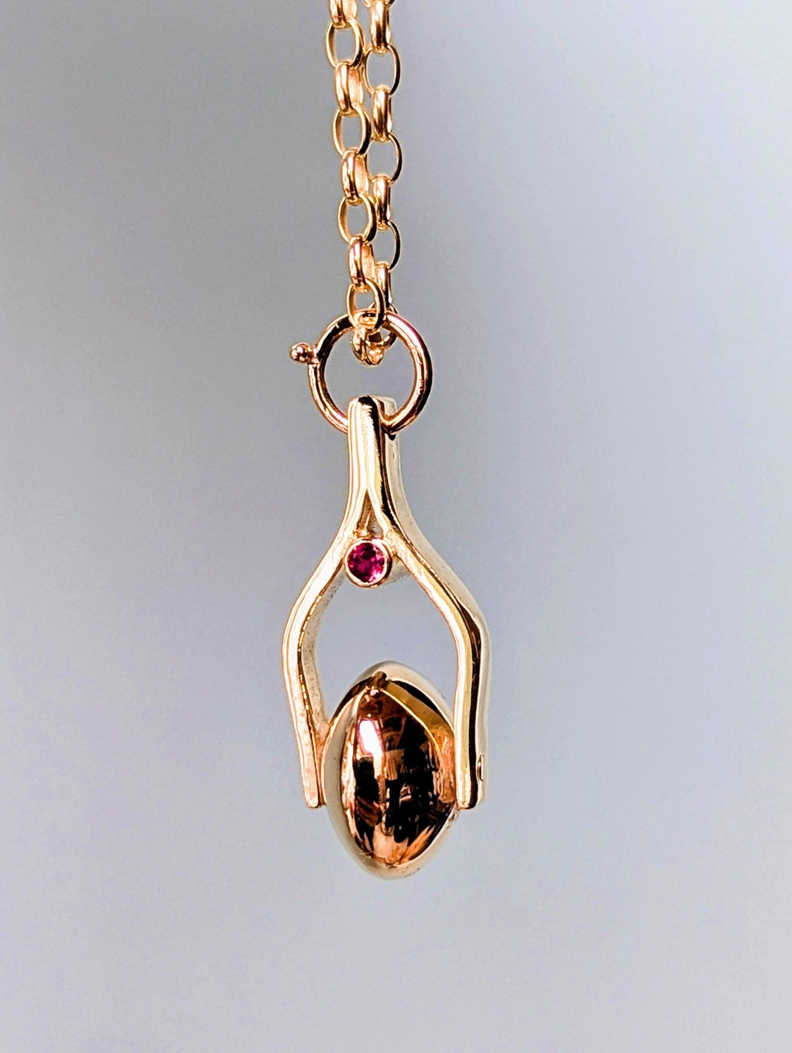 Gold Spinning Moon Necklace with pink tourmalines made by Booblinka Jewellery