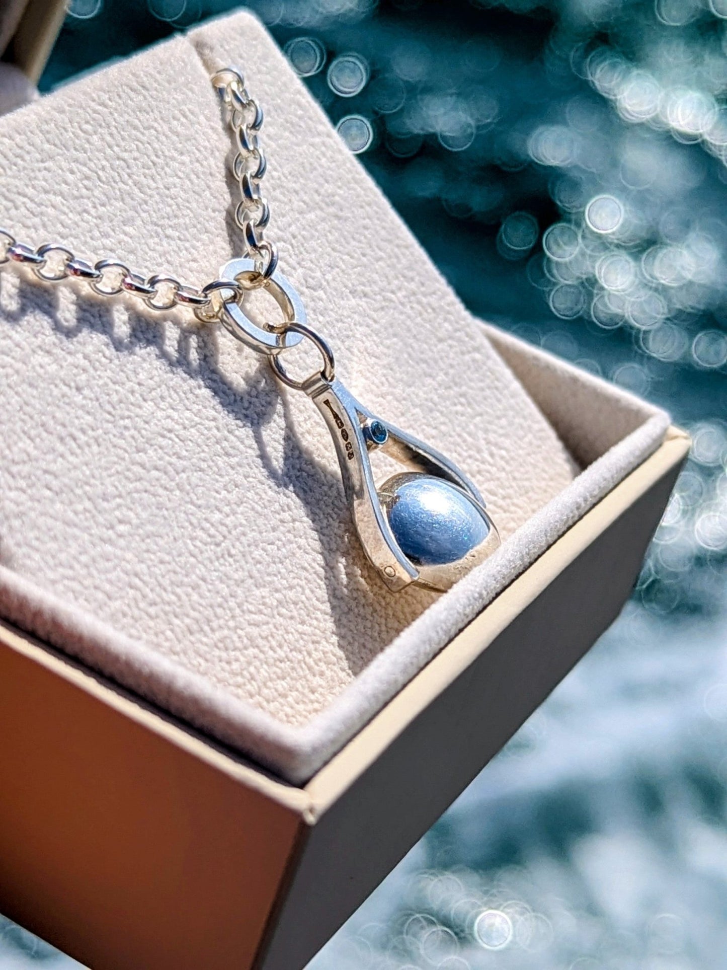 Sterling Silver Spinning Pendant Necklace with Blue Topaz – Made to OrderSpinning NecklacesBooblinka Jewellery