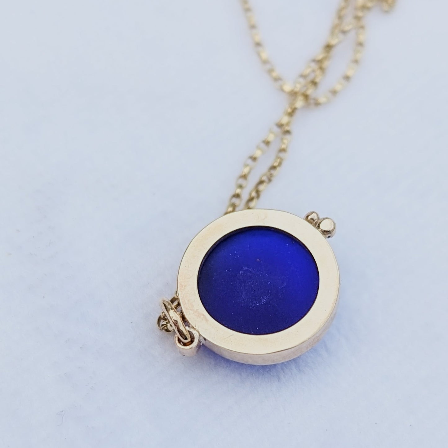 9ct Gold Cobalt Blue Sea Glass Necklace  by Booblinka Jewellery A detailed view of the back of the cobalt blue sea glass pendant, showing the open bezel design.