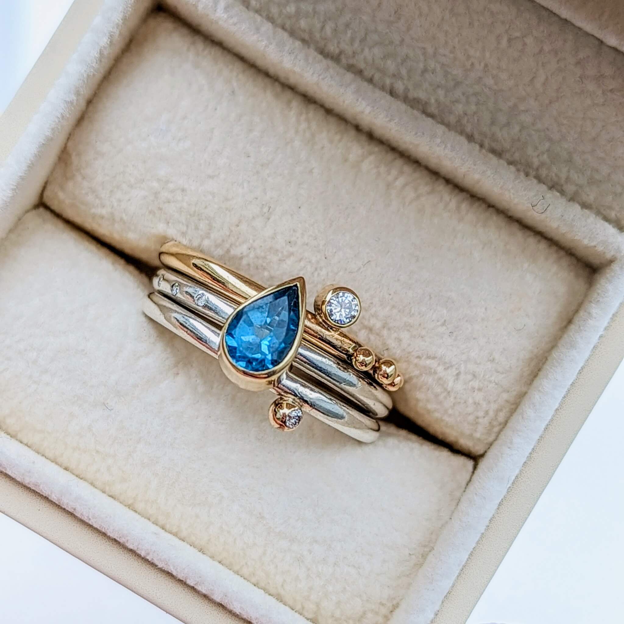 Teardrop Swiss blue topaz spinning ring with moissanites Ocean Collection