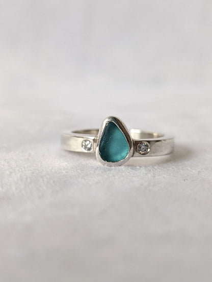 Aqua Blue Sea Glass and Moissanite Silver Ring  from Allure Collection on white velvet by Booblinka Jewellery