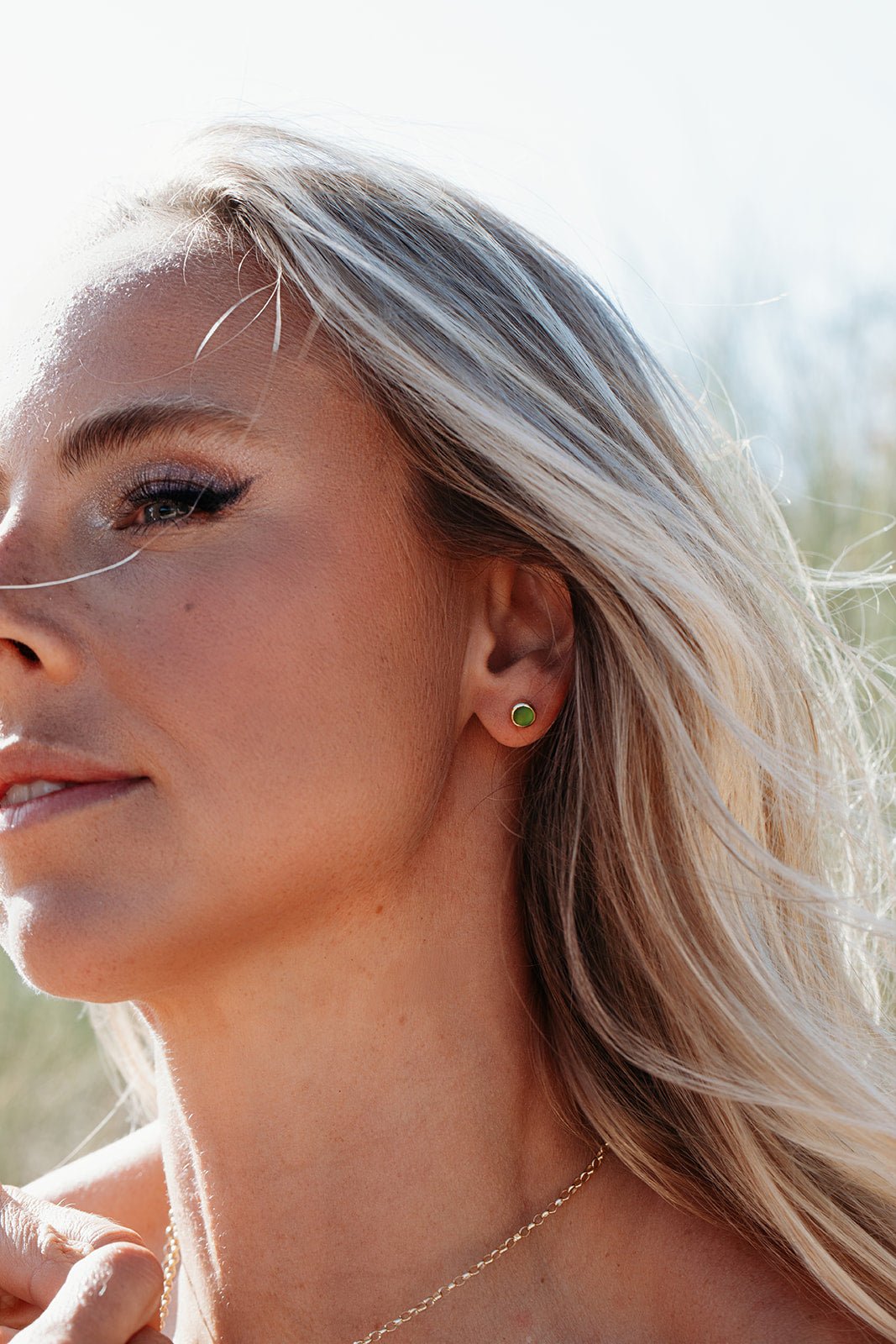 Model wearing Green Sea Glass Stud Earrings in 9ct Gold Earrings handmade by Booblinka Jewellery
