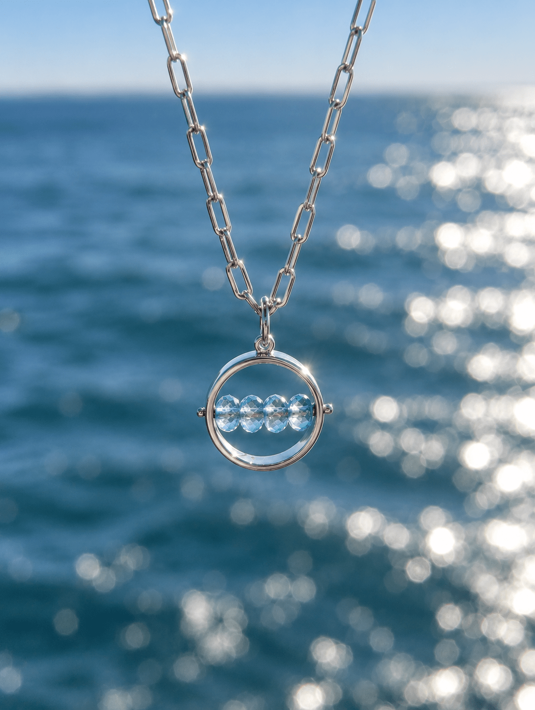 HALO – 9ct White Gold Spinning Blue Topaz NecklaceNecklacesBooblinka Jewellery