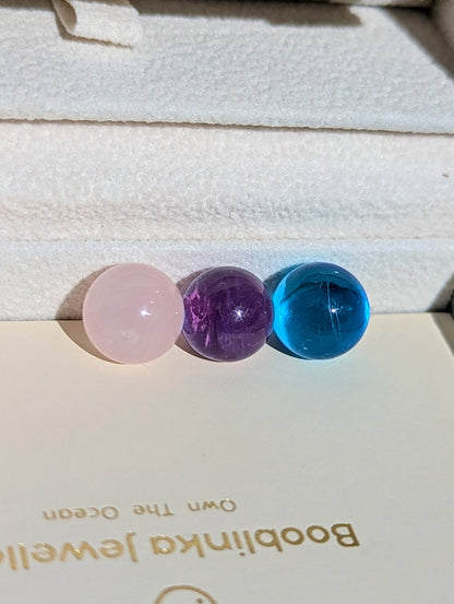 Three gemstone spheres available for the ORB necklace: pale pink Rose Quartz, purple Amethyst and bright blue Swiss Blue Topaz.