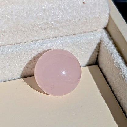 Close-up of the smooth pale pink Rose Quartz sphere available to choose for the silver ORB necklace