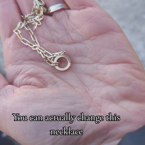 Video showing how the gold connector works - it is a hinged ring you can add different charms on a gold paperclip chain.