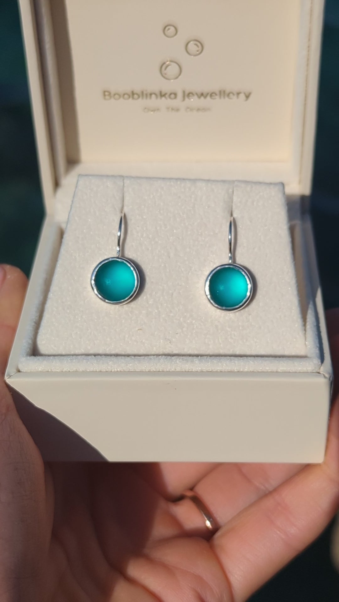 Video of Teal Sea Glass Drop Earrings in Sterling Silver in a jewellery box made by Booblinka Jewellery