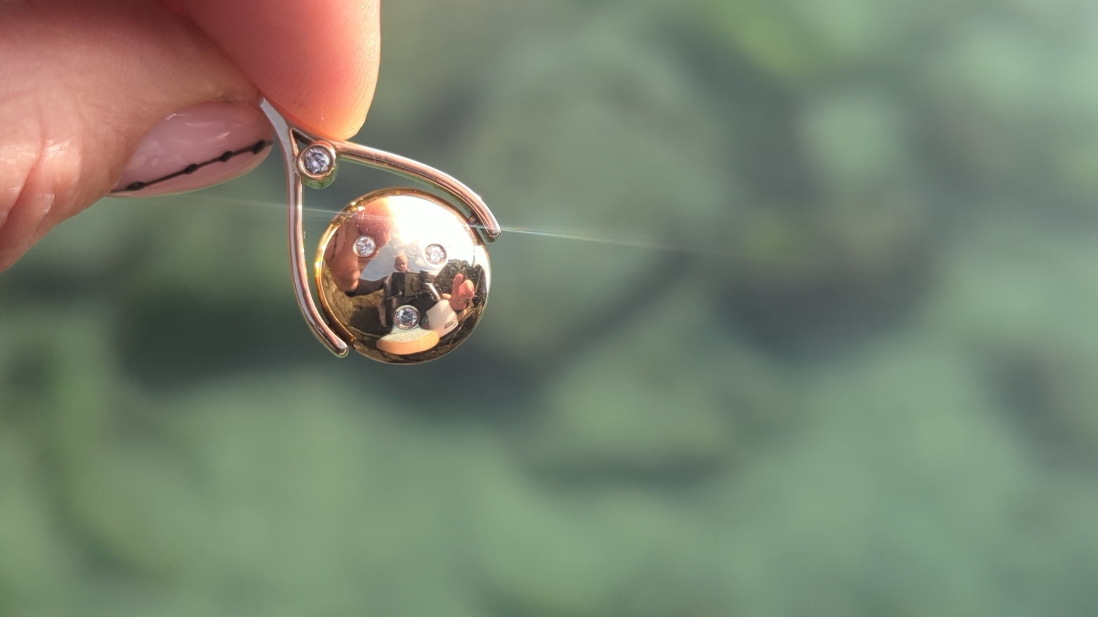 Load video: Gold spinning necklaces showing the movement