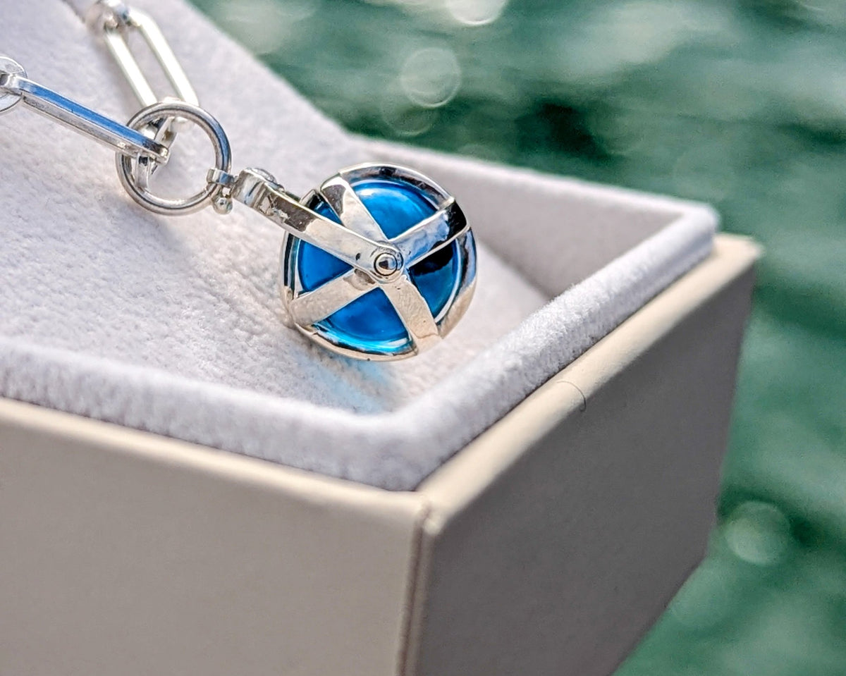 Silver Spinning Swiss Blue Topaz Necklace – ORBNecklacesBooblinka Jewellery