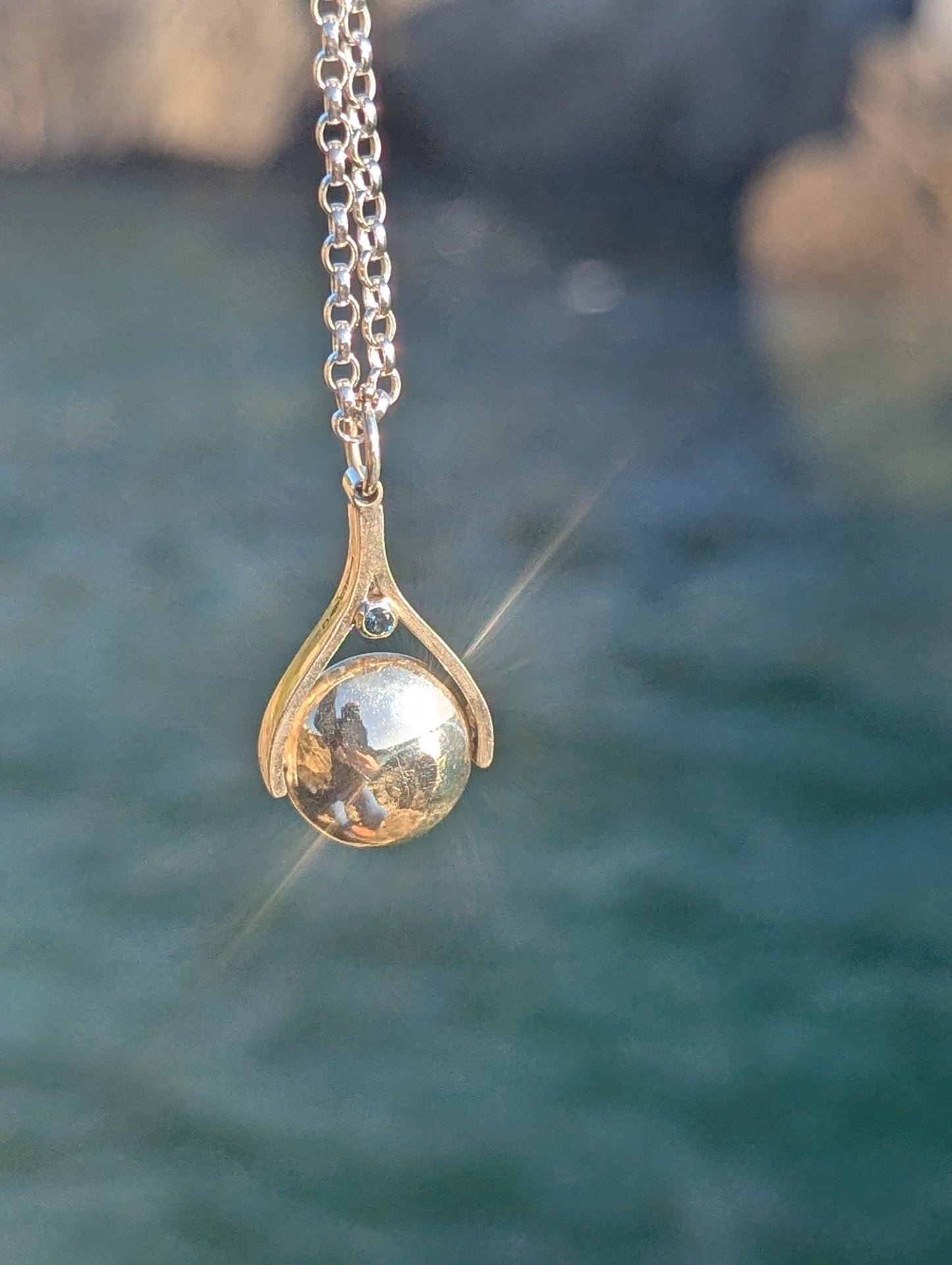 Spinning Minstrel Silver Necklace with London Blue Topaz – Ocean - Inspired JewelleryNecklacesBooblinka Jewellery
