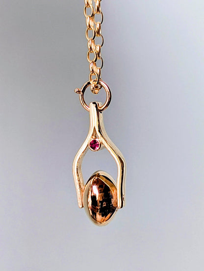 Gold Spinning Moon Necklace with pink tourmalines made by Booblinka Jewellery