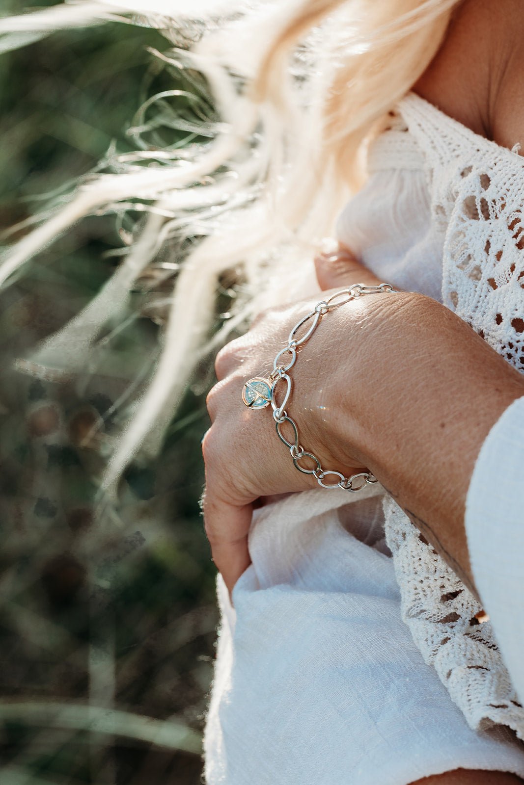 Sky Blue Topaz Sphere Link Bracelet  worn on a model hand from Drop of the Ocean Collection by Booblinka Jewellery