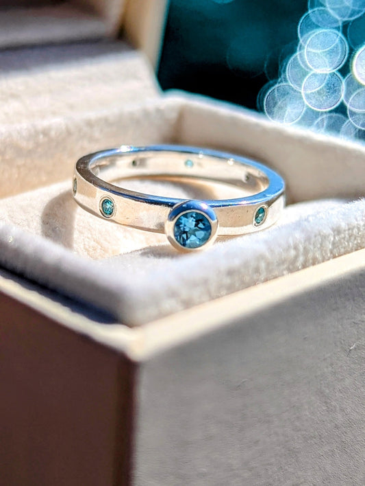 Sterling Silver Ring with Blue Topaz and Cubic Zirconia Set into the BandRingsBooblinka Jewellery