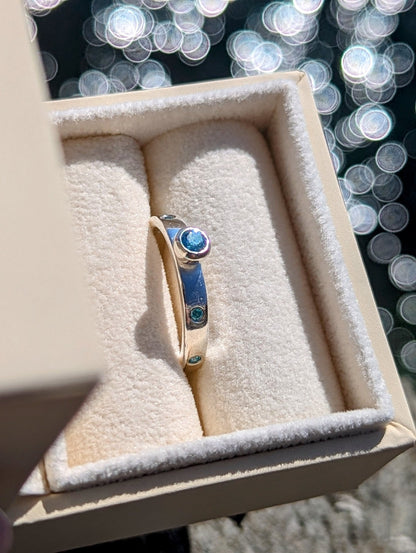 Sterling Silver Ring with Blue Topaz and Cubic Zirconia Set into the BandRingsBooblinka Jewellery