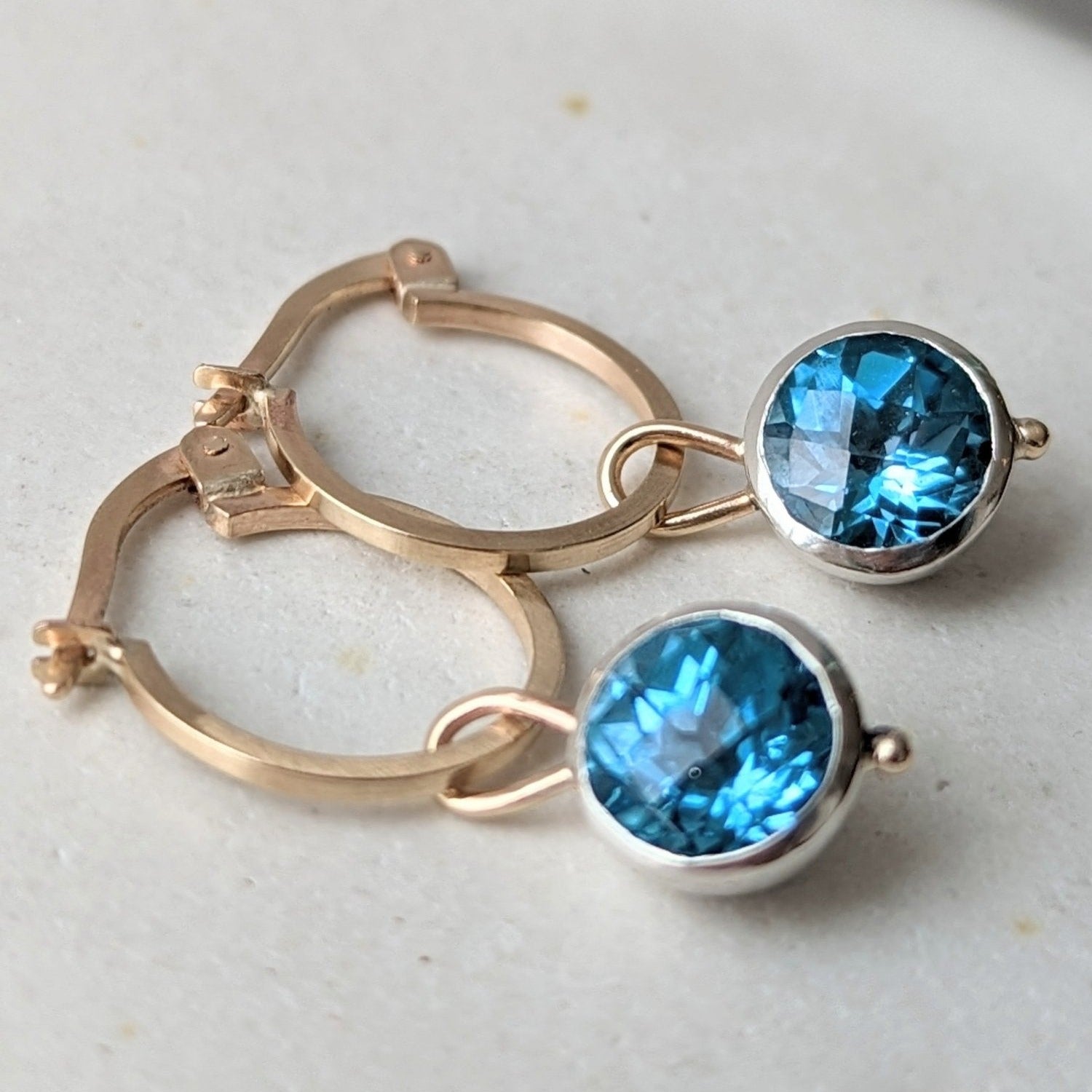 Gold hoop earrings with removable charms with Swiss blue topaz from Ocean Collection by Booblinka Jewellery