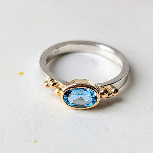 Gold and Silver Engagement Ring with oval Swiss Blue Topaz - Ocean Collection by Booblinka Jewellery