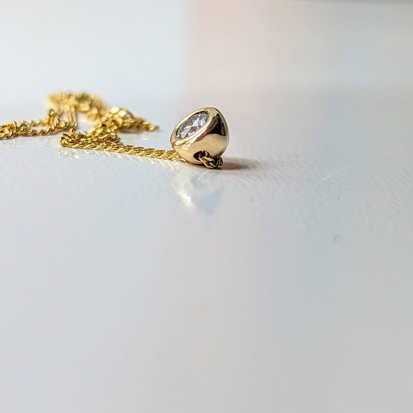 Side detail of Gold Floating Moissanite Necklace – DEI Collection by Booblinka Jewellery