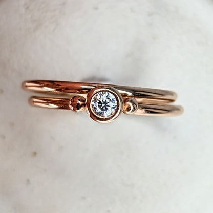 Dainty rose gold stacking engagement rings with sparkly moissanite DEI collection by Booblinka Jewellery