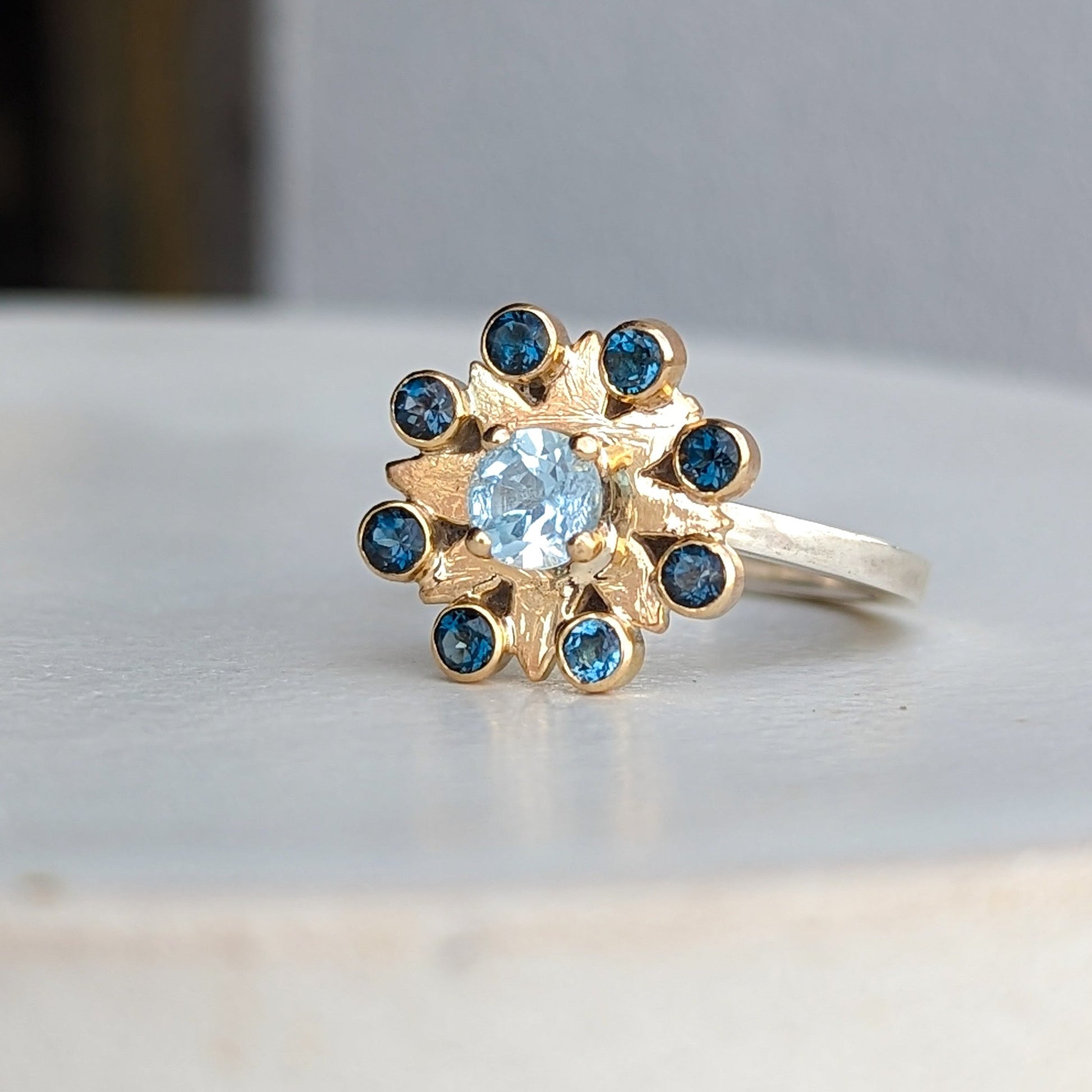 Flower Gold and silver cluster ring with sky blue topaz and London blue topaz ring by Booblinka Jewellery