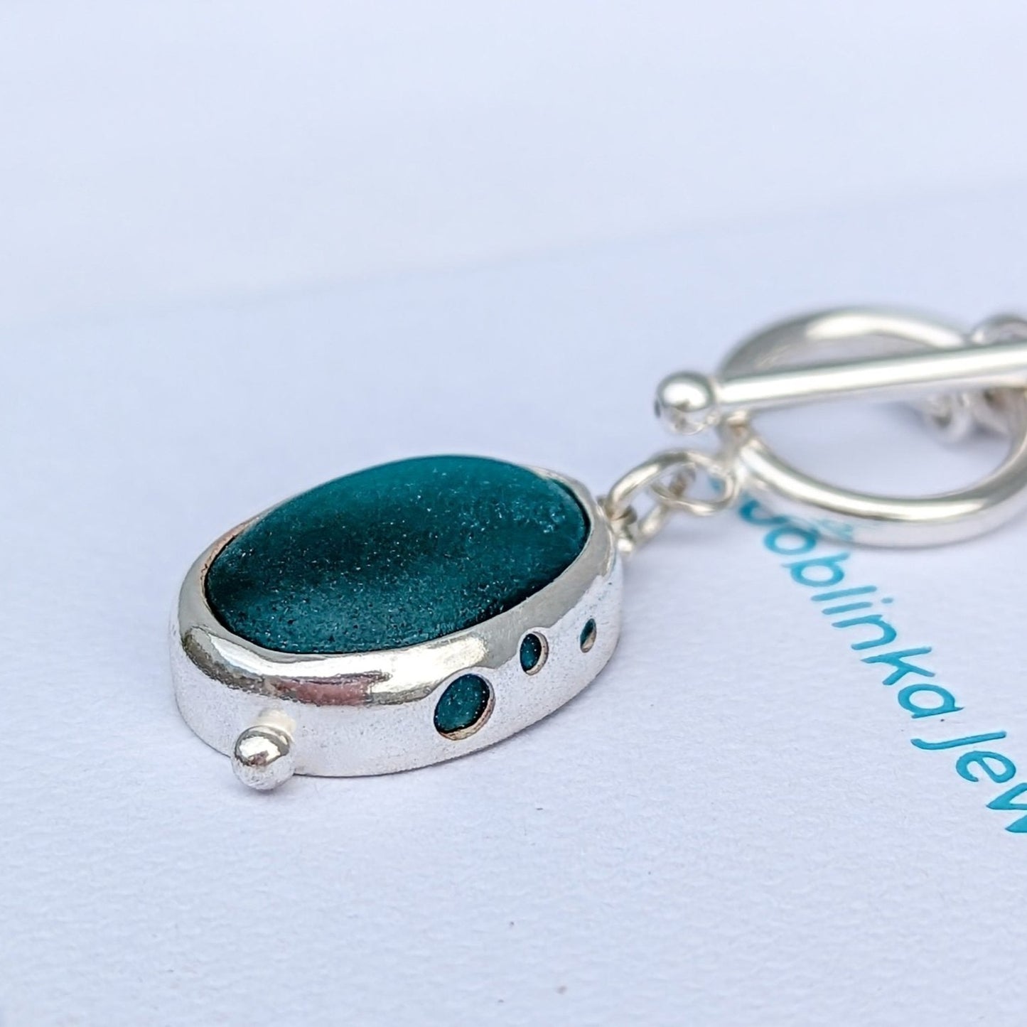 Teal oval sea glass silver necklace with nature design and satin finish with toggle clasp by Booblinka Jewellery