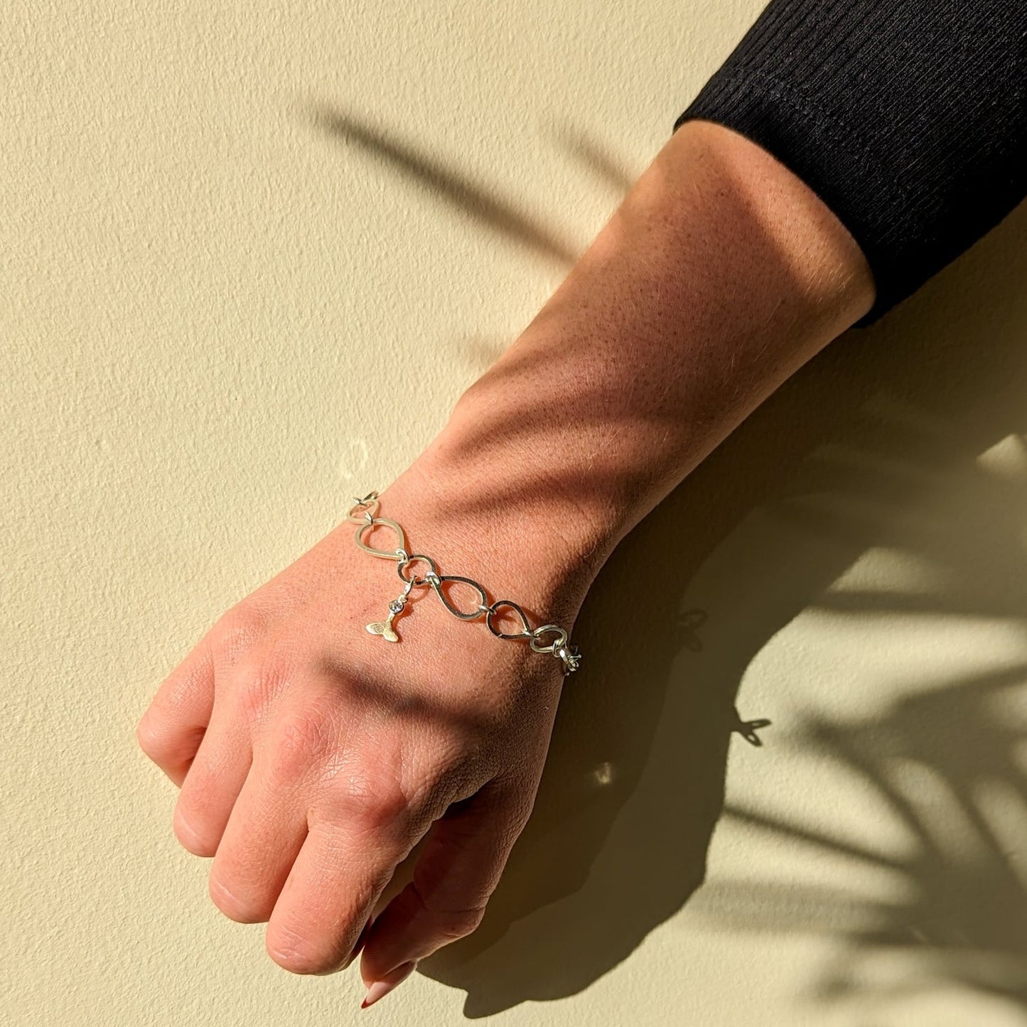 Silver link statement bracelet with gold mermaid charm with moissanite by Booblinka Jewellery